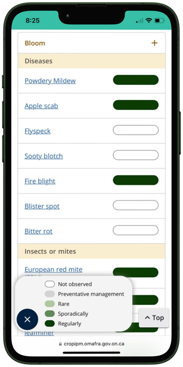 Phone screen with scouting calendar for pests of apples displayed